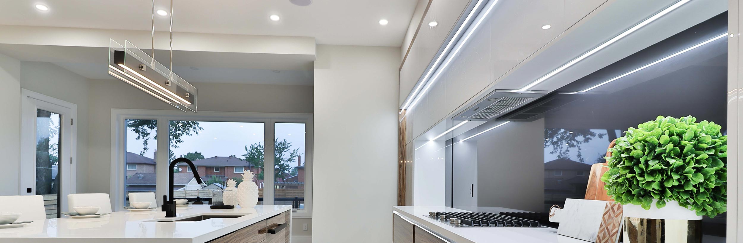 White modern kitchen with lights on
