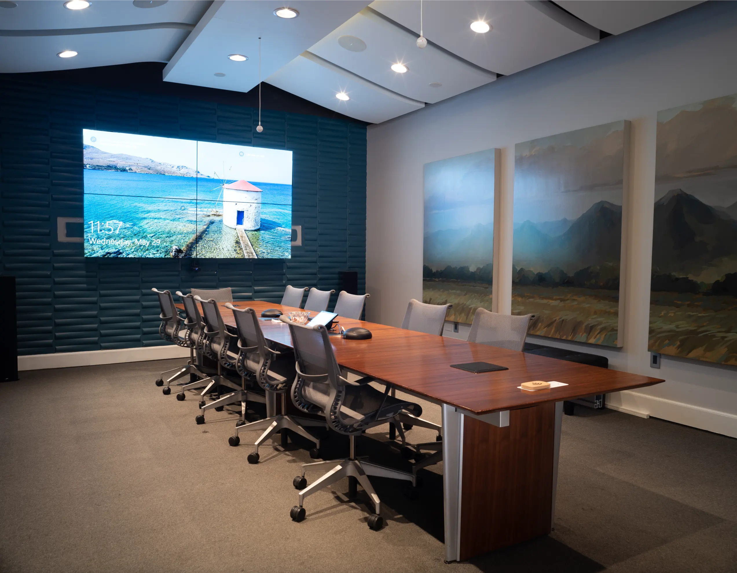 Conference room with rolling chairs and wall art