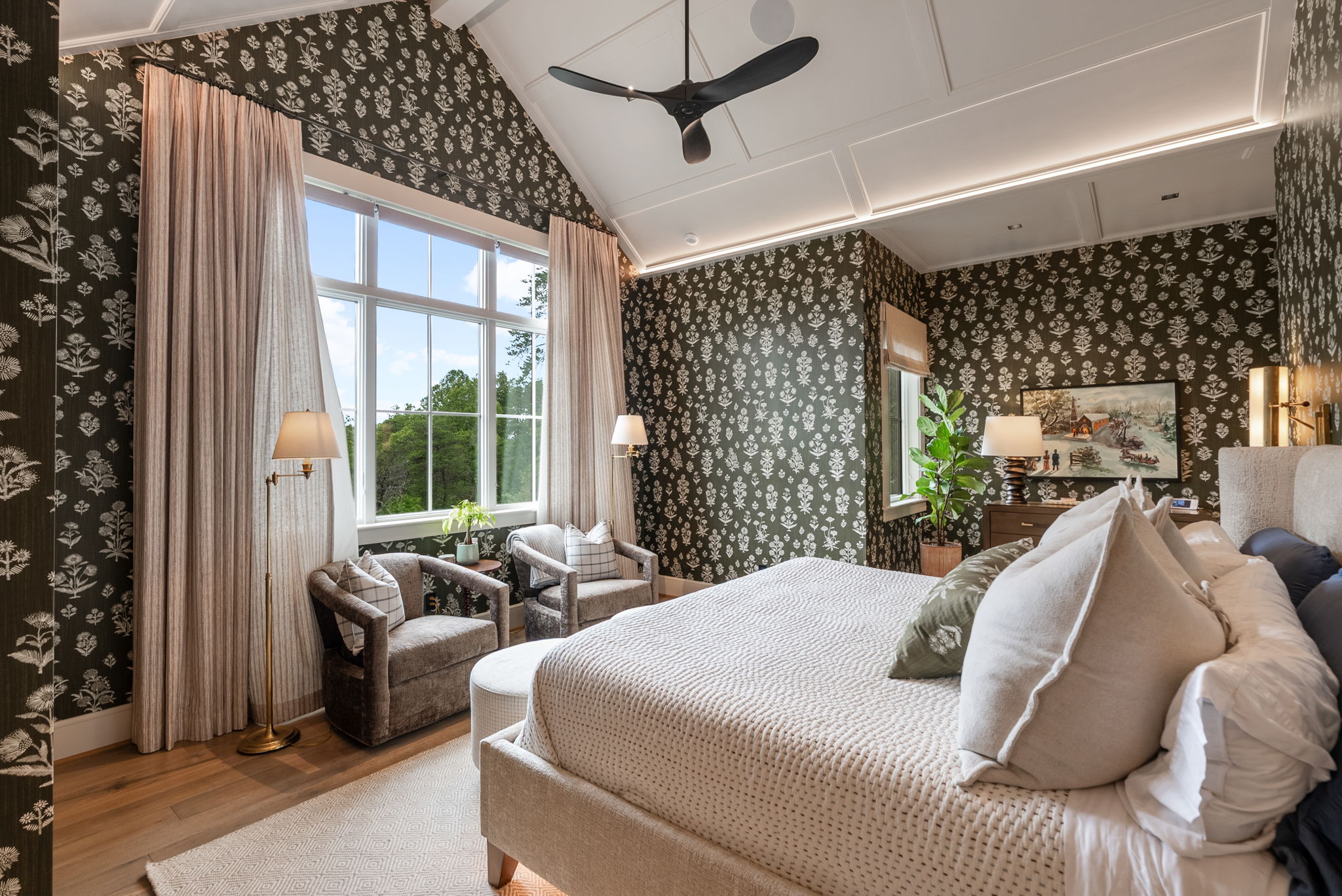 Bedroom with large windows and patterned wall covering