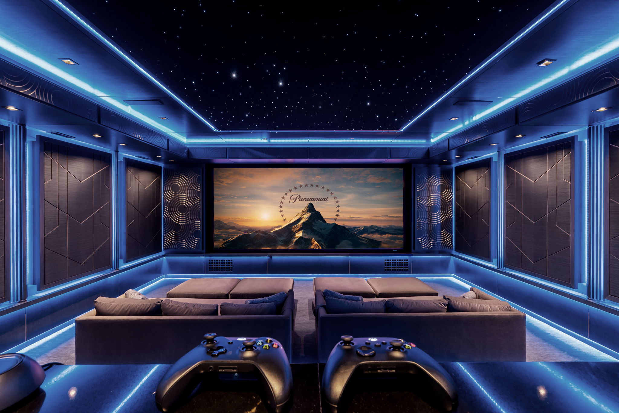 Private cinema with lounge seating and a large screen