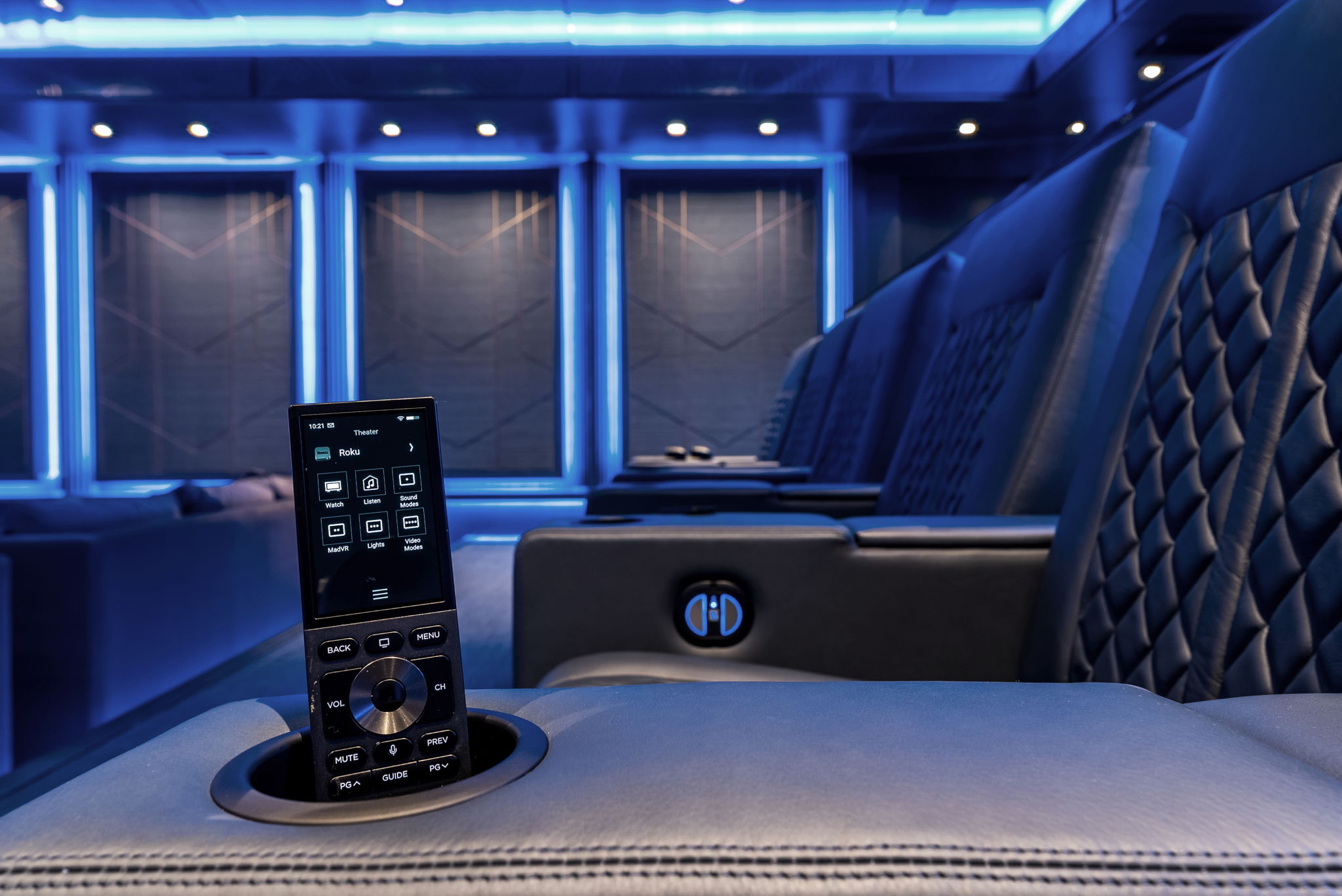 Control4 remote in front of upholstered seating