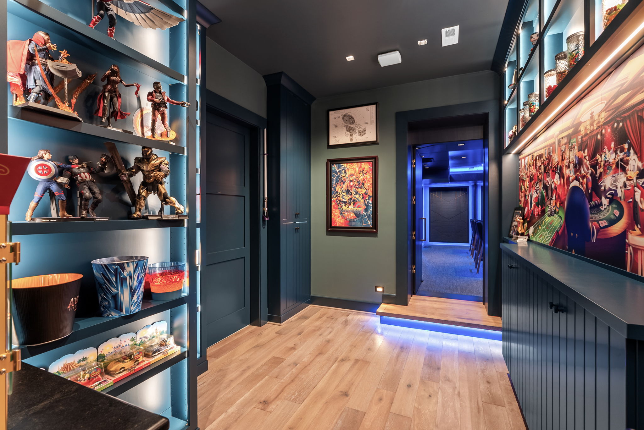 Hallway with display shelves leading toward the private cinema