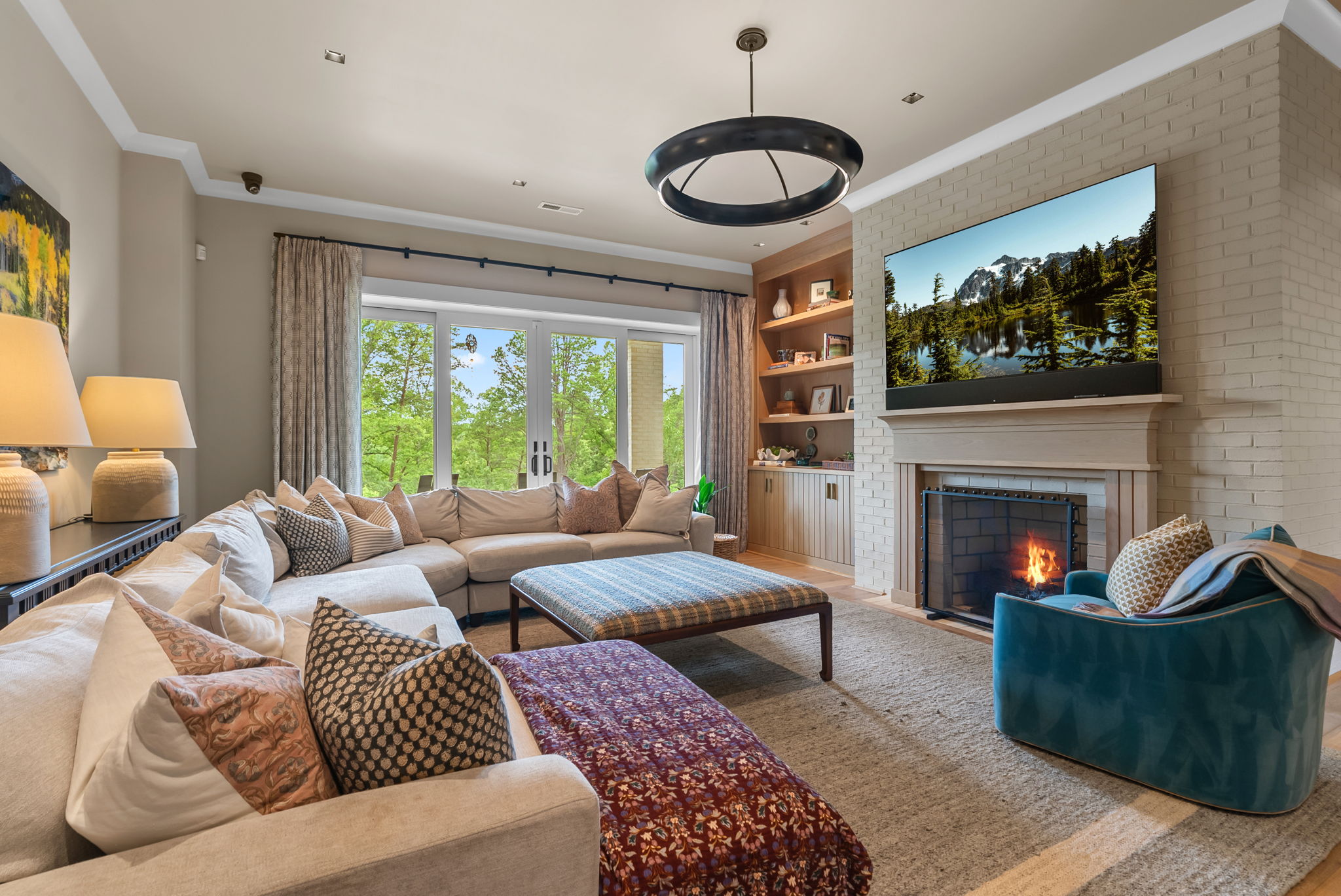 Sitting area with a fireplace and television