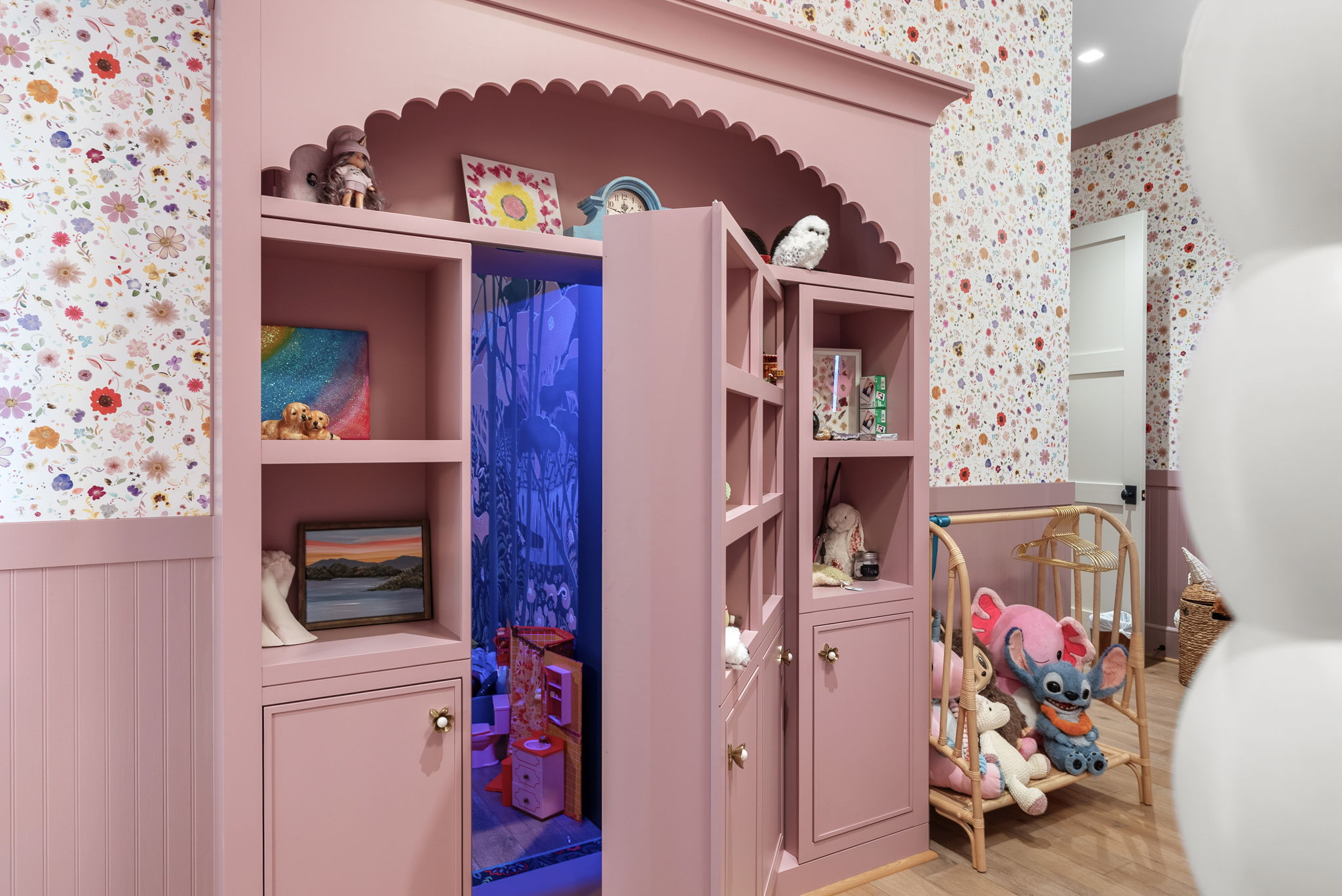 Pink wardrobe opening into the children’s hidden playroom