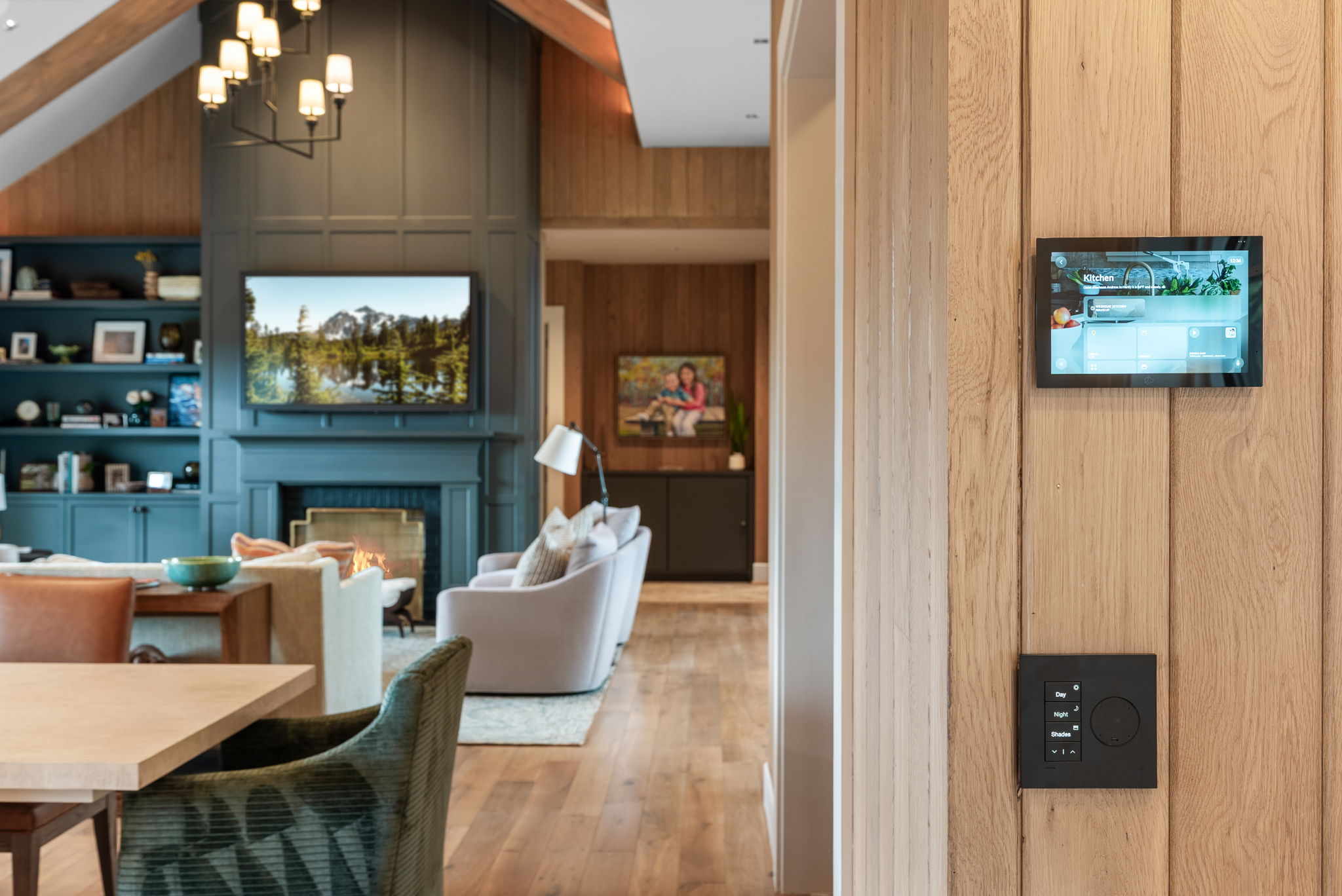 Wall-mounted smart home touch panel beside the living area
