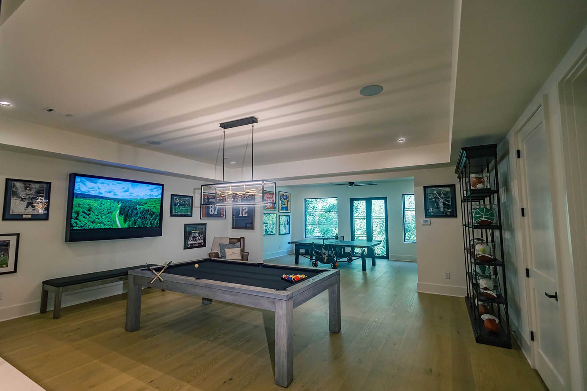 Game room with TV and pool tables