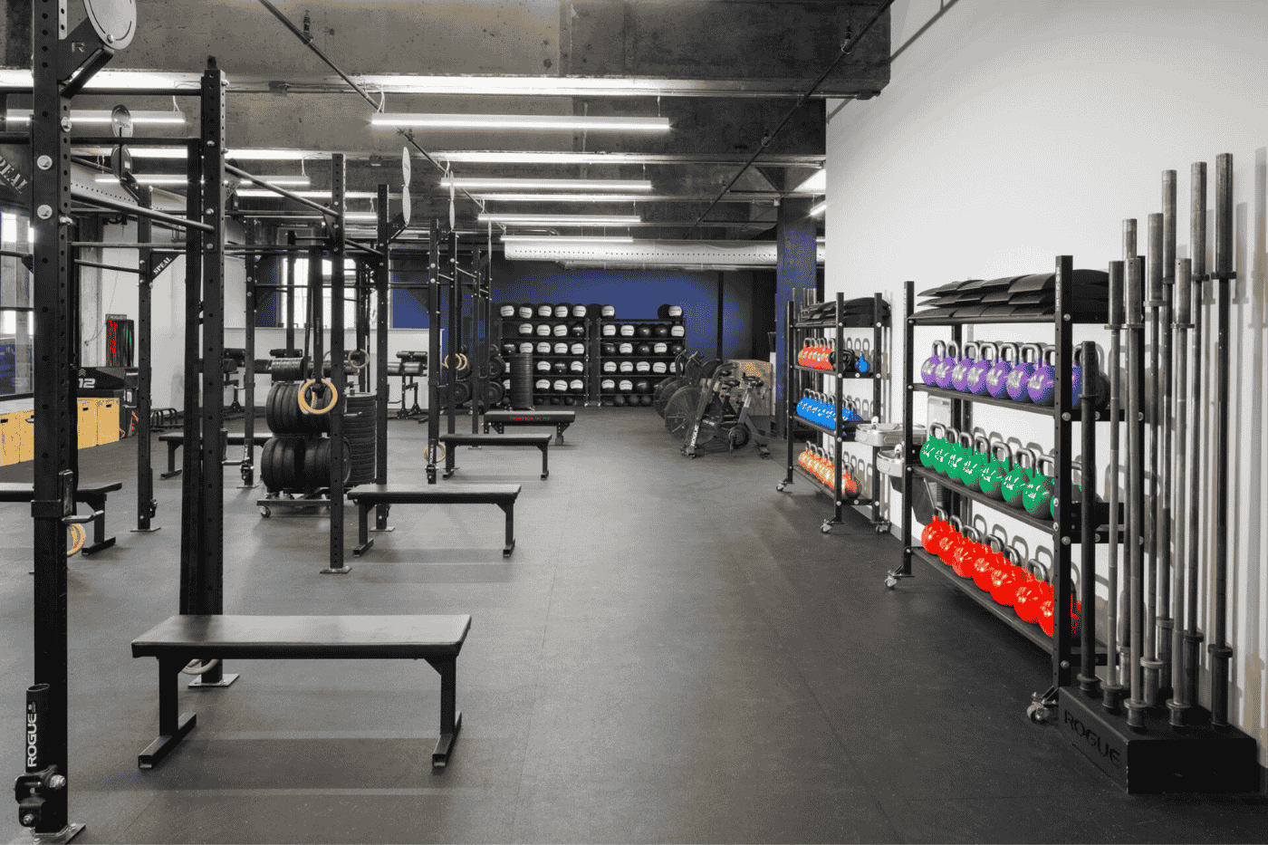 Gym space with weight benches and kettle bells